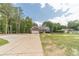 Well-kept home featuring an attached two-car garage and a long concrete driveway at 1623 Pratt Rd, Covington, GA 30014