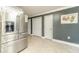 Kitchen featuring stainless steel refrigerator plus access to storage space and secondary rooms at 1623 Pratt Rd, Covington, GA 30014