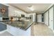 Kitchen with granite countertops, stainless appliances, a kitchen island, and white cabinetry at 1623 Pratt Rd, Covington, GA 30014