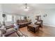 Bright living room features a high ceiling, an open layout, and cozy leather furniture at 1623 Pratt Rd, Covington, GA 30014