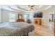 Large main bedroom featuring trey ceiling, wood floors, sitting area, and ensuite access at 1623 Pratt Rd, Covington, GA 30014