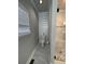 Bathroom features toilet, and tiled shower with black hardware and pebble floor at 2668 Memorial Se Dr, Atlanta, GA 30317