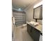 Contemporary bathroom featuring a vessel sink, granite countertop, and stylish tile flooring at 2668 Memorial Se Dr, Atlanta, GA 30317
