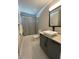 Modern bathroom featuring gray vanity with granite countertop and square vessel sink at 2668 Memorial Se Dr, Atlanta, GA 30317