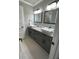 Stylish bathroom with double vanity, granite countertops, and modern fixtures at 2668 Memorial Se Dr, Atlanta, GA 30317