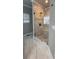 Modern bathroom boasts tiled shower with bench and elegant pebble floor at 2668 Memorial Se Dr, Atlanta, GA 30317