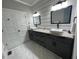 Stylish bathroom features a double vanity, granite counters, and modern mirrors at 2668 Memorial Se Dr, Atlanta, GA 30317