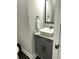 Stylish half-bathroom with vessel sink, granite countertop, and modern fixtures at 2668 Memorial Se Dr, Atlanta, GA 30317
