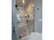 Bright bathroom features a glass shower with bench and modern fixtures at 2668 Memorial Se Dr, Atlanta, GA 30317