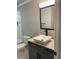 Stylish bathroom featuring a vessel sink, modern faucet, and a vanity with storage at 2668 Memorial Se Dr, Atlanta, GA 30317