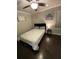 Cozy bedroom with dark wood floors, a comfortable bed, and natural light from the window at 2668 Memorial Se Dr, Atlanta, GA 30317
