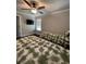 Bedroom featuring two beds, hardwood floors, a ceiling fan, and natural light at 2668 Memorial Se Dr, Atlanta, GA 30317