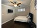 Well-lit bedroom with hardwood floors, a ceiling fan, and a comfortable bed at 2668 Memorial Se Dr, Atlanta, GA 30317