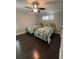 Bright bedroom with two beds, hardwood floors, and ceiling fan at 2668 Memorial Se Dr, Atlanta, GA 30317