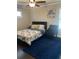 Cozy bedroom with a bed and floral comforter at 2668 Memorial Se Dr, Atlanta, GA 30317