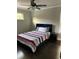 Cozy bedroom with a comfortable bed, modern side table, and plenty of natural light at 2668 Memorial Se Dr, Atlanta, GA 30317
