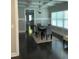 Open dining area with dark hardwood floors, a modern table, and lots of windows at 2668 Memorial Se Dr, Atlanta, GA 30317