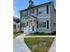 Charming two-story home with gray siding, dark shutters, and a welcoming front porch at 2668 Memorial Se Dr, Atlanta, GA 30317