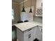 Modern kitchen with white cabinets, granite countertops, and stylish pendant lighting at 2668 Memorial Se Dr, Atlanta, GA 30317