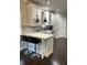 Open kitchen with white cabinets, granite countertops, breakfast bar, and stainless steel appliances at 2668 Memorial Se Dr, Atlanta, GA 30317