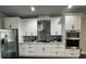 Modern kitchen features white cabinets, granite counters, and stainless appliances at 2668 Memorial Se Dr, Atlanta, GA 30317