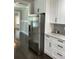 Modern kitchen featuring stainless steel refrigerator and white cabinetry at 2668 Memorial Se Dr, Atlanta, GA 30317
