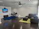 Open concept living room with dark wood floors and a comfortable sectional sofa at 2668 Memorial Se Dr, Atlanta, GA 30317