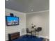 Bright living room featuring a TV mounted on a wall and desk at 2668 Memorial Se Dr, Atlanta, GA 30317