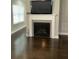 Comfortable living room with a fireplace, a large screen television, and hardwood floors at 2668 Memorial Se Dr, Atlanta, GA 30317