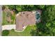 An aerial view displays this home's well-designed landscaping, pool and manicured lawn at 115 Windover Ct, Roswell, GA 30075
