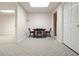 Basement area with diamond pattern carpet, a table with 3 chairs and access to other rooms at 115 Windover Ct, Roswell, GA 30075