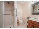 Bathroom with a glass shower, toilet, sink and a metallic shelf at 115 Windover Ct, Roswell, GA 30075