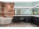 Luxurious bathroom with soaking tub, wood accent wall, large vanity, and tile floor at 115 Windover Ct, Roswell, GA 30075