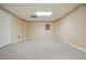 Bright bedroom area with large carpet and a door at 115 Windover Ct, Roswell, GA 30075