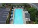 An aerial view of the community pool with lounge chairs and umbrellas at 115 Windover Ct, Roswell, GA 30075