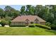 Charming single-story home boasting a well-manicured lawn and inviting stone accents at 115 Windover Ct, Roswell, GA 30075