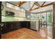 Modern kitchen featuring stainless appliances, custom cabinets, and a bright breakfast nook at 115 Windover Ct, Roswell, GA 30075