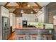 Charming kitchen with stainless steel appliances, light countertops, breakfast bar and rustic wood paneling at 115 Windover Ct, Roswell, GA 30075