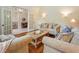Inviting living room with hardwood floors, two sofas, and an open entry into another room at 115 Windover Ct, Roswell, GA 30075