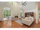 Inviting living room with a fireplace and French doors to the outdoor porch at 115 Windover Ct, Roswell, GA 30075