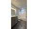 The bathroom features granite countertops, a shower, and grey cabinets at 3204 Fairington Village Dr, Lithonia, GA 30038