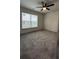 This bedroom features a ceiling fan, and a window at 3204 Fairington Village Dr, Lithonia, GA 30038