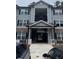 Apartment building featuring multi-story living with a staircase and parking at 3204 Fairington Village Dr, Lithonia, GA 30038