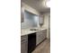 Modern kitchen boasts gray cabinets, granite countertops, and stainless steel appliances at 3204 Fairington Village Dr, Lithonia, GA 30038