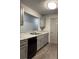 Gray kitchen with stainless steel sink, gray cabinets, and modern appliances at 3204 Fairington Village Dr, Lithonia, GA 30038
