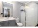 Bathroom featuring a glass-enclosed shower with subway tile and vanity with sink at 623 Brennan Dr, Decatur, GA 30033