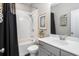 Bathroom featuring a shower-tub combo and stylish vanity at 623 Brennan Dr, Decatur, GA 30033