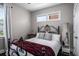 Cozy bedroom featuring a wrought iron bed frame, small table and lots of natural light at 623 Brennan Dr, Decatur, GA 30033