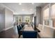Elegant dining space with hardwood floors, modern furniture, and direct access to a modern kitchen at 623 Brennan Dr, Decatur, GA 30033