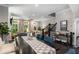 Open dining area with a view into the living room and staircase; naturally lit with elegant fixtures at 623 Brennan Dr, Decatur, GA 30033